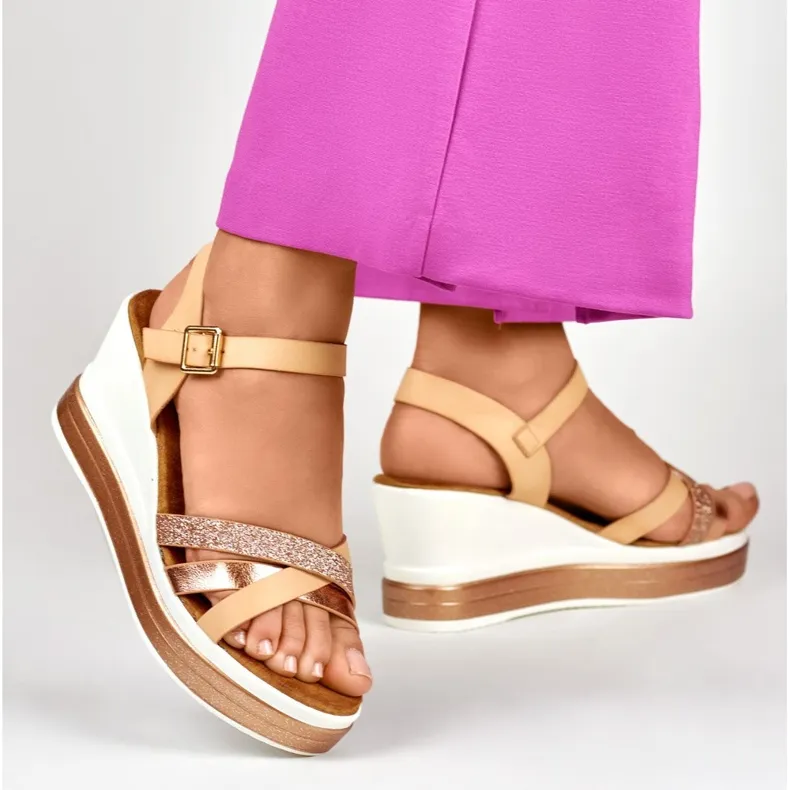 Beige wedge sandals with a shiny strap