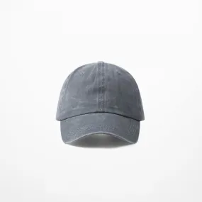 Black baseball cap aged denim jeans faded effect