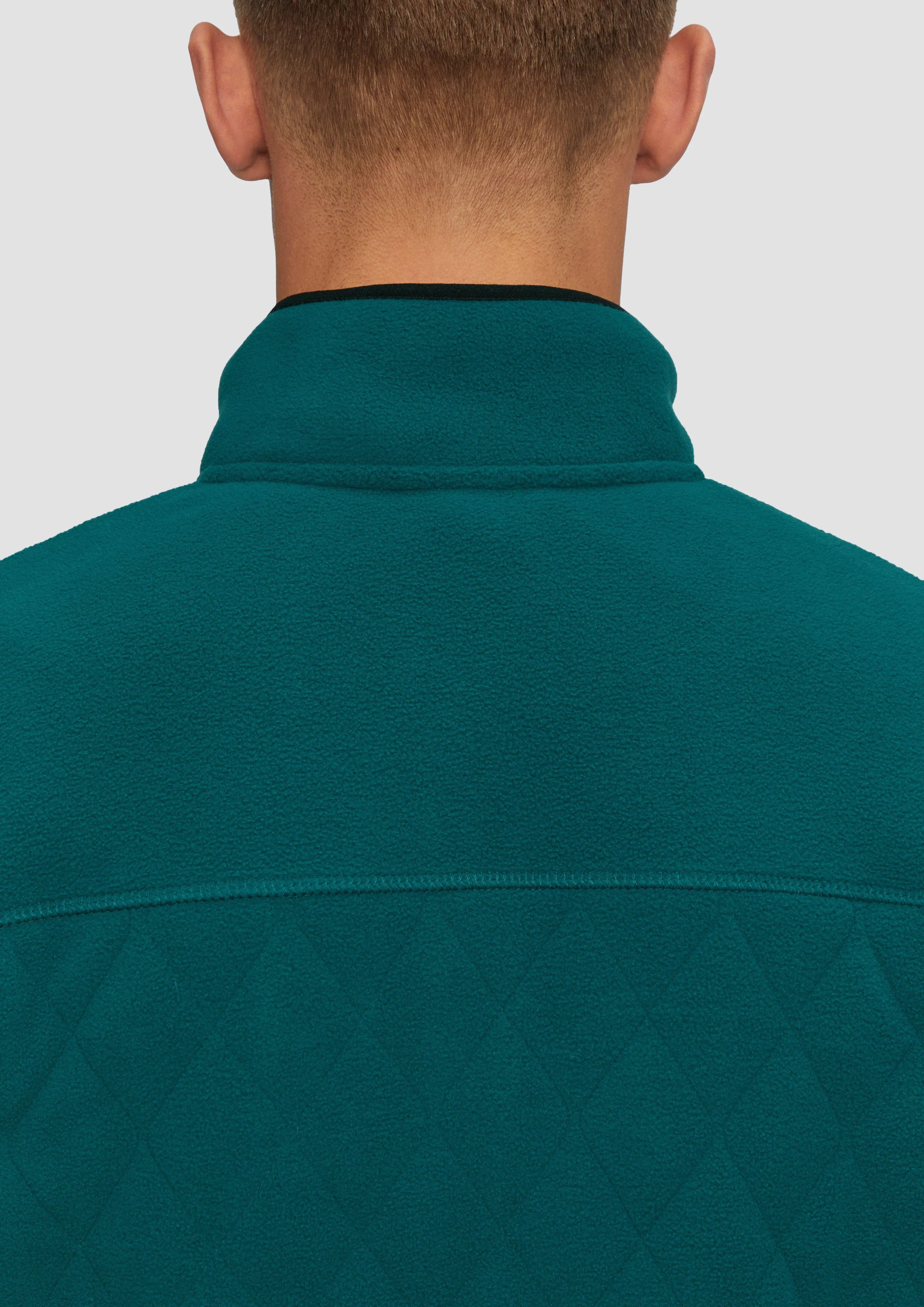 Fleece jacket in a mix of materials with topstitched details