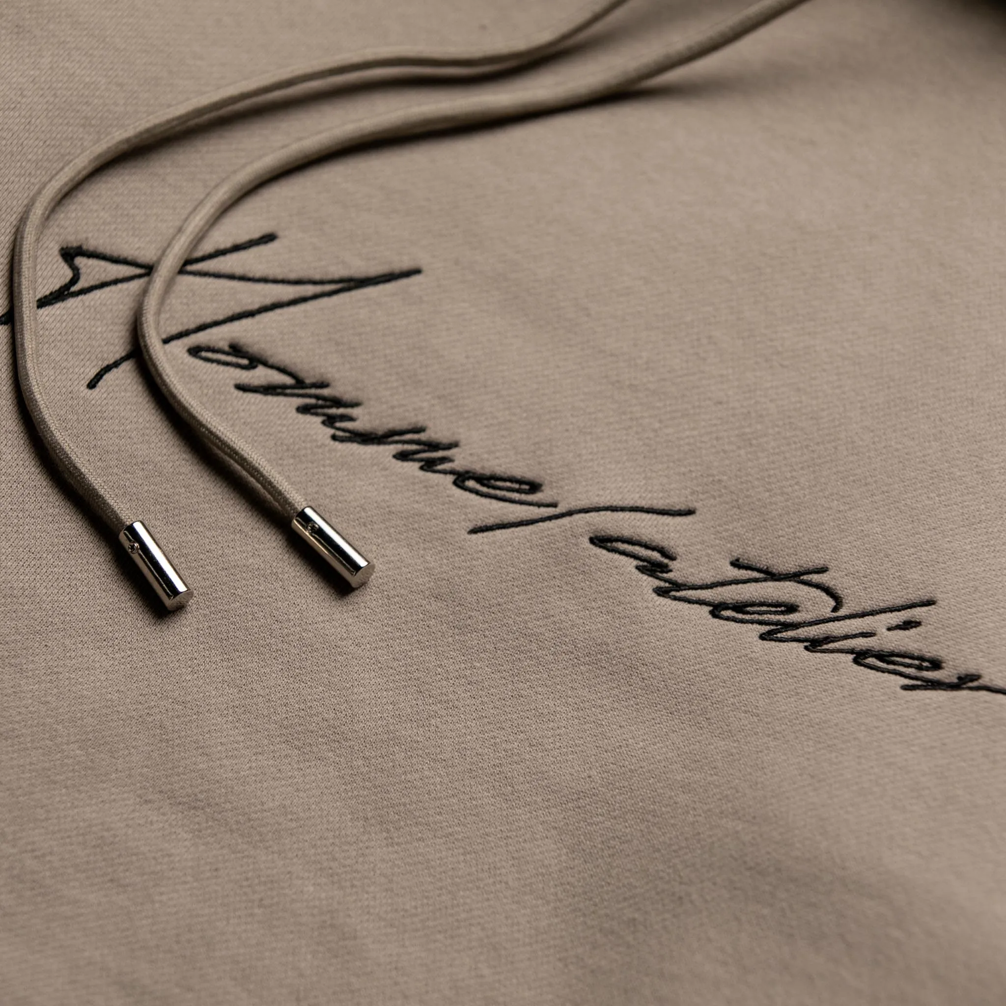 HOMME+ Heavyweight Atelier Embroidery Hoodie Cement