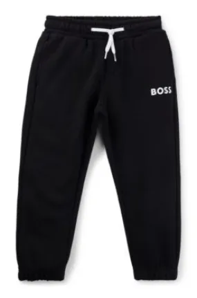 Kids' fleece tracksuit bottoms with logo print