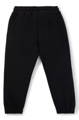 Kids' fleece tracksuit bottoms with logo print